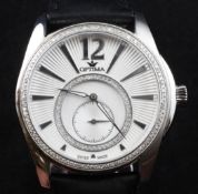 A gentleman`s modern stainless steel and diamond set Optima quartz wrist watch, with sunburst