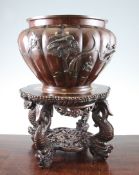 A Japanese bronze jardiniere and a Chinese rosewood stand, c.1900, the Japanese jardiniere cast in