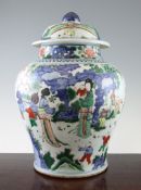 A large Chinese Wucai baluster jar and cover, in Transitional style, painted with ladies and