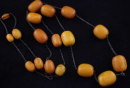 A single strand graduated amber bead necklace, gross weight 79 grams, 41in