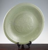 A rare and massive Chinese Longquan celadon carved charger, 15th century, Ming dynasty, the centre