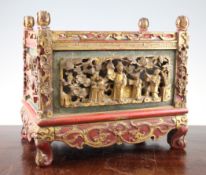 A Chinese polychrome wood jardiniere, early 20th century, the side panels pierced and carved in