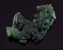 A 14ct gold mounted jadeite brooch, carved in the form of a phoenix, with a Gem & Pearl Laboratory