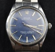 A gentleman`s early 1970`s stainless steel Rolex Oyster Perpetual wristwatch, with blue dial and