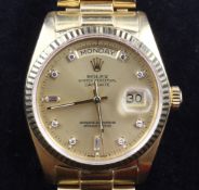 A gentleman`s 1970`s 18ct gold Rolex Oyster Perpetual Day Date wrist watch, with yellow dial and