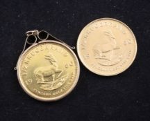 Two 1980 gold half Krugerrands, one in 9ct gold mount.