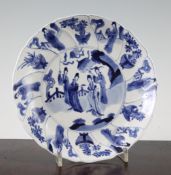 A Chinese blue and white dish, Kangxi six character mark and of the period, painted to the centre