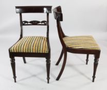 A set of eight Regency style mahogany dining chairs, with shaped crest rails and drop in seats, on