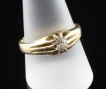 An early 20th century 18ct gold claw set solitaire diamond ring, size V.