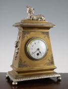 A Victorian Egyptian revival parcel silvered brass mantel timepiece, surmounted with a figure of the