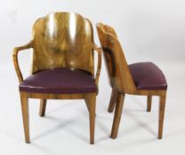 A set of eight Art Deco walnut cloud back dining chairs, including two with arms and six singles,