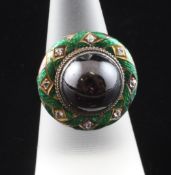 An Edwardian 18ct gold and cabochon almandine garnet ring, with rose cut diamond set and green