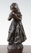 An early 20th century French patinated bronze figure of a young girl holding a bowl, entitled `