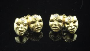 A pair of 18ct gold and diamond set "comedy and tragedy" mask ear studs.