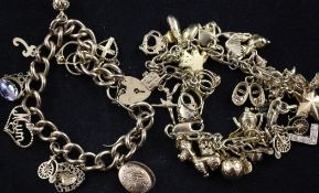 Two 9ct gold charm bracelets, each hung with assorted charms, gross 68 grams.