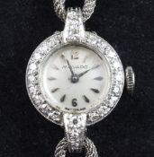 A lady`s 1950`s platinum and diamond set Movado cocktail watch, with baton numerals and diamond