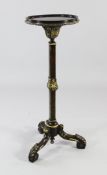 A walnut and parcel gilt torchere, with dish top, on square section column and three scrolling