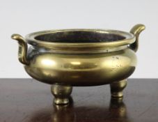 A Chinese bronze ding censer, Xuande six character mark, 18th century or earlier, the squat globular