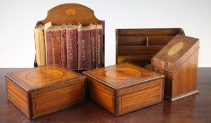 A pair of Edwardian inlaid satinwood caskets, 6in., a desk stand with leather bound reference works,