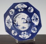 A Bow powder blue octagonal plate, c.1765, the central panel painted with a Chinese riverscape and