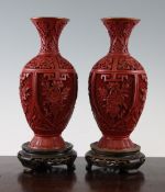 A pair of Chinese cinnabar lacquer vases, first half 20th century, each carved in high relief with