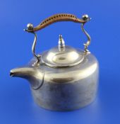 A George V silver kettle, with rattan handle and stamped on base "The Original Ambleside Kettle",