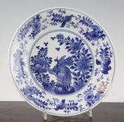 A Japanese Arita blue and white plate, 18th century, painted to the centre with two pheasants amid