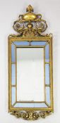 A 19th century rectangular gilt wall mirror, with urn and scroll crest, the central mirror plate