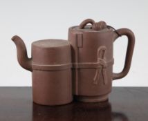 A Chinese Yixing pottery double barrel teapot and cover, modelled with fruit, 16.5cm.