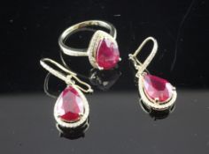 A suite of 14ct gold, ruby and diamond set jewellery, comprising ring and pair of drop earrings,