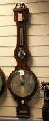 A Regency strung mahogany wheel barometer, with silvered hygrometer, thermometer, mirror, dial and