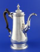 A George II silver baluster coffee pot, with turned finial and scroll capped spout, William Shaw &