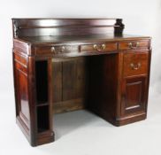 A large Victorian clerk`s desk, originally from Coutts Bank, with stepped gallery back, gilt