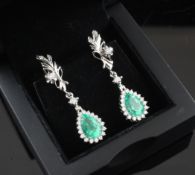 A pair of white gold, diamond and pear shaped emerald cluster drop earrings, with diamond set