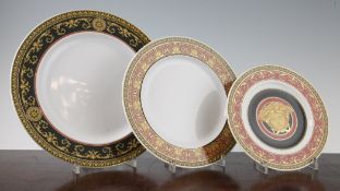 Twenty four Rosenthal Versace Medusa pattern plates, comprising eight 10.75in. dinner plates,