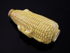 A Chinese moulded porcelain `corn cob` snuff bottle, 19th century, yellow glazed a relief moulded