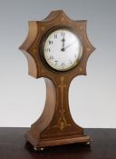 An Edwardian inlaid mahogany mantel timepiece, with starburst balloon case and eight day movement,