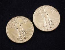 Two US Gold Eagle 50 dollar coins.