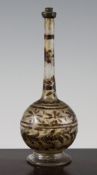 An Ottoman glass bottle shaped water sprinkler, Turkish 18th / 19th century, with painted leaf and