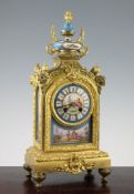 A 19th century French ormolu and porcelain mantel clock, decorated with panels of figures in