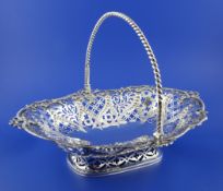 A George III pierced silver cake basket by Emes & Barnard, of oval form, with beaded and star and