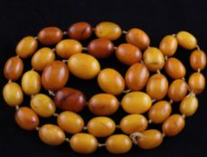 A single strand graduated oval amber bead necklace, gross 167 grams, 41in.