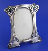 An Edwardian Art Nouveau silver and enamel photograph frame by William Hutton & Sons Ltd, of