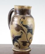 A Martin Brothers stoneware ovoid jug, c.1881, incised with Persian style flowers and scrolling