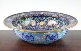 A good Chinese Canton enamel basin, Daoguang period (1821-50), painted to the centre with ornamental