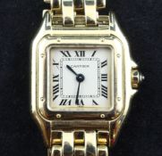 A lady`s 1980`s 18ct gold Cartier Panthere quartz wrist watch, with Roman dial and cabochon sapphire