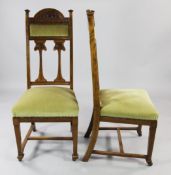 A set of six Glasgow School Art Nouveau oak dining chairs, with arched crest rails, tulip flower