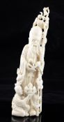 A Chinese ivory group of Shou Lao, early 20th century, the immortal holding a staff in his left hand