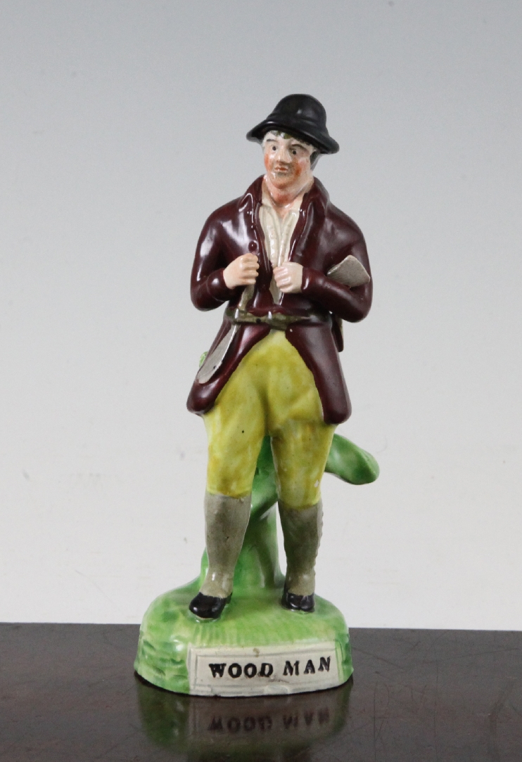 A Staffordshire pearlware figure `Woodman`, c.1820, probably Enoch Wood or Hall, the standing figure