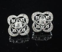 A pair of Art Deco style 18ct white gold and diamond cluster ear studs, of pierced cusped form.